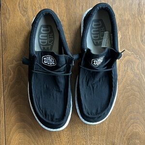 Men’s black Hey Dude stretch slip ons